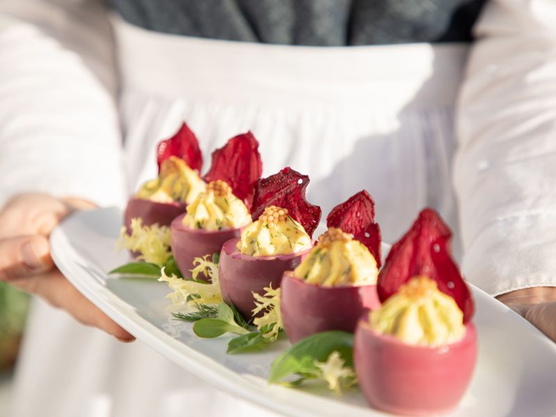 Tray of beet-dyed deviled eggs