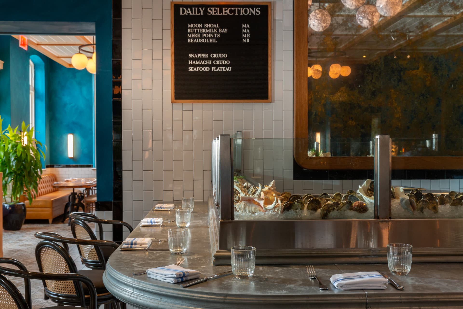 Marble raw bar counter with oysters on ice