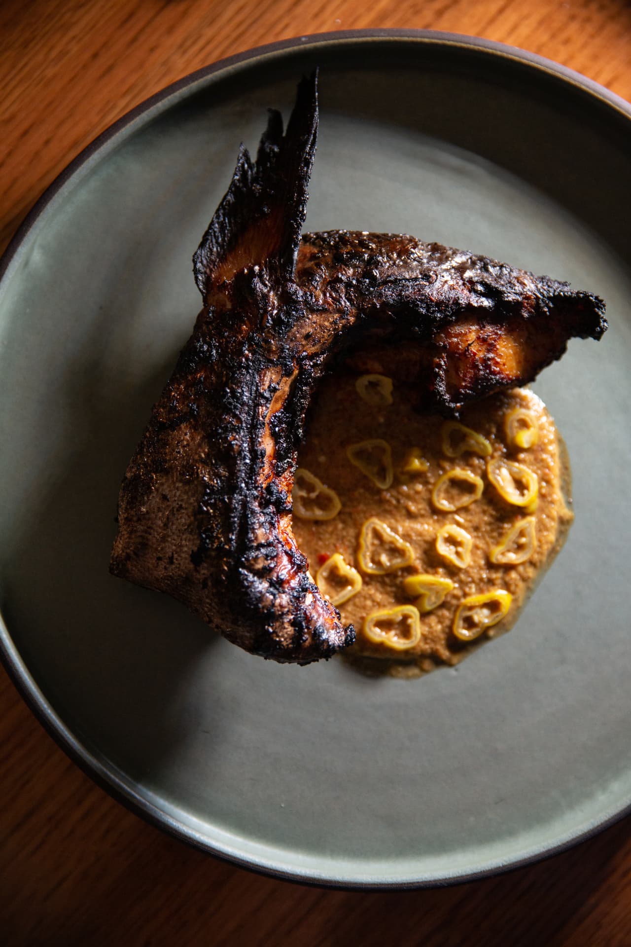 Charred fish collar with pepper sauce