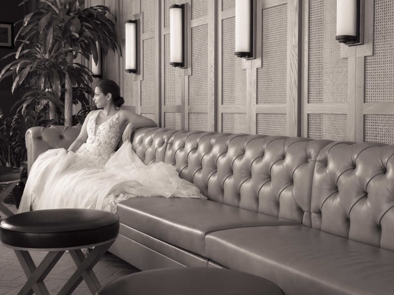 Bride on a tufted leather banquette