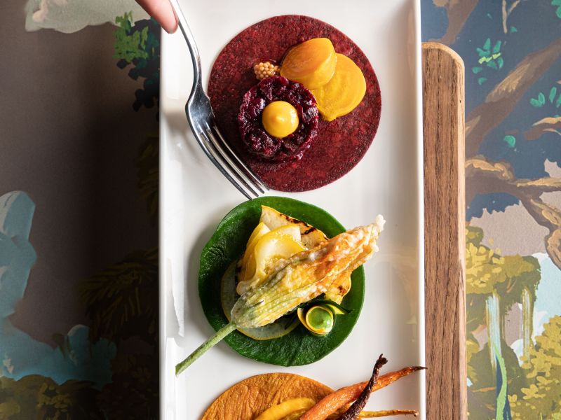 Chef's tasting plate of beets, squash blossom and carrots
