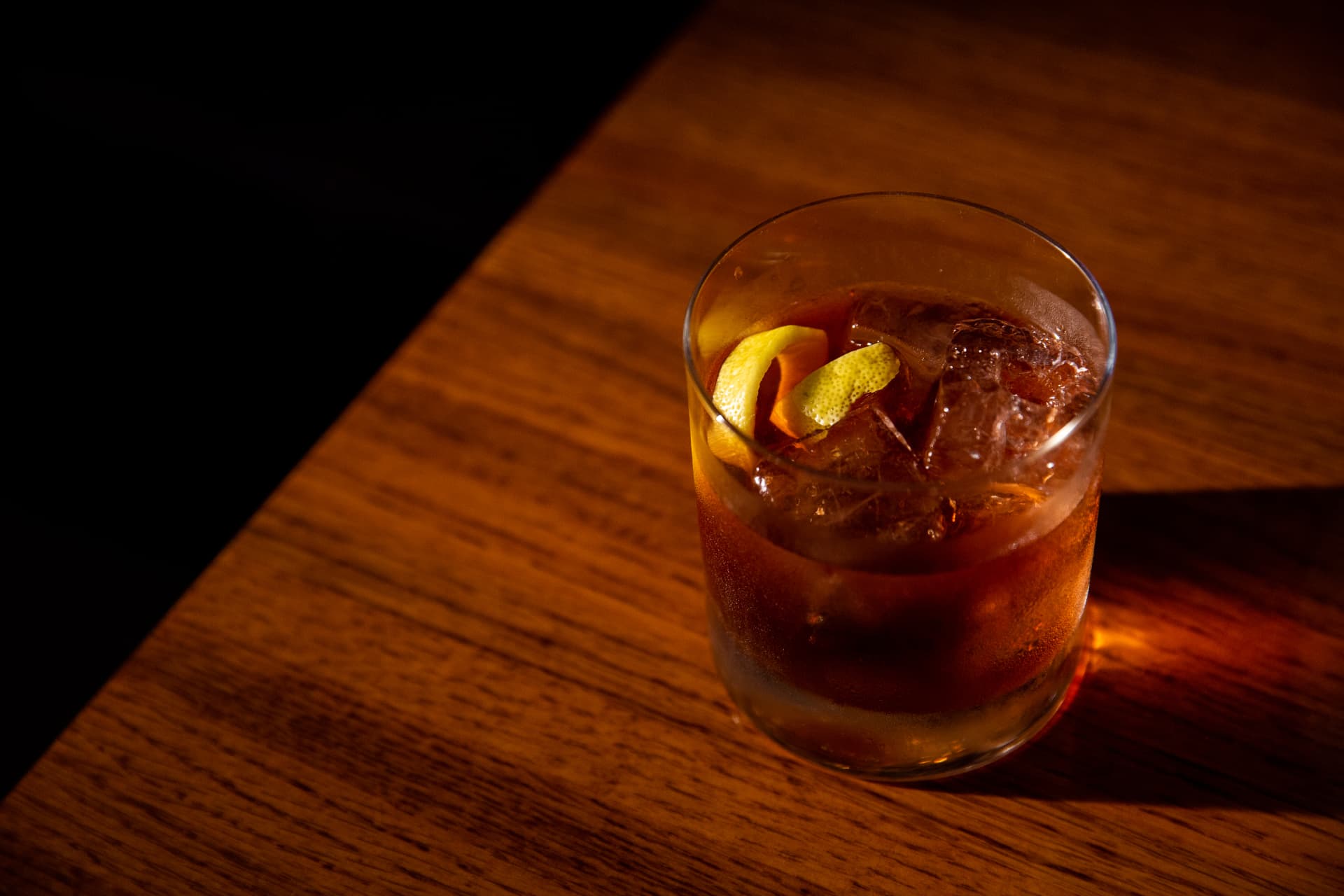 Old fashioned with a lemon twist on the bar